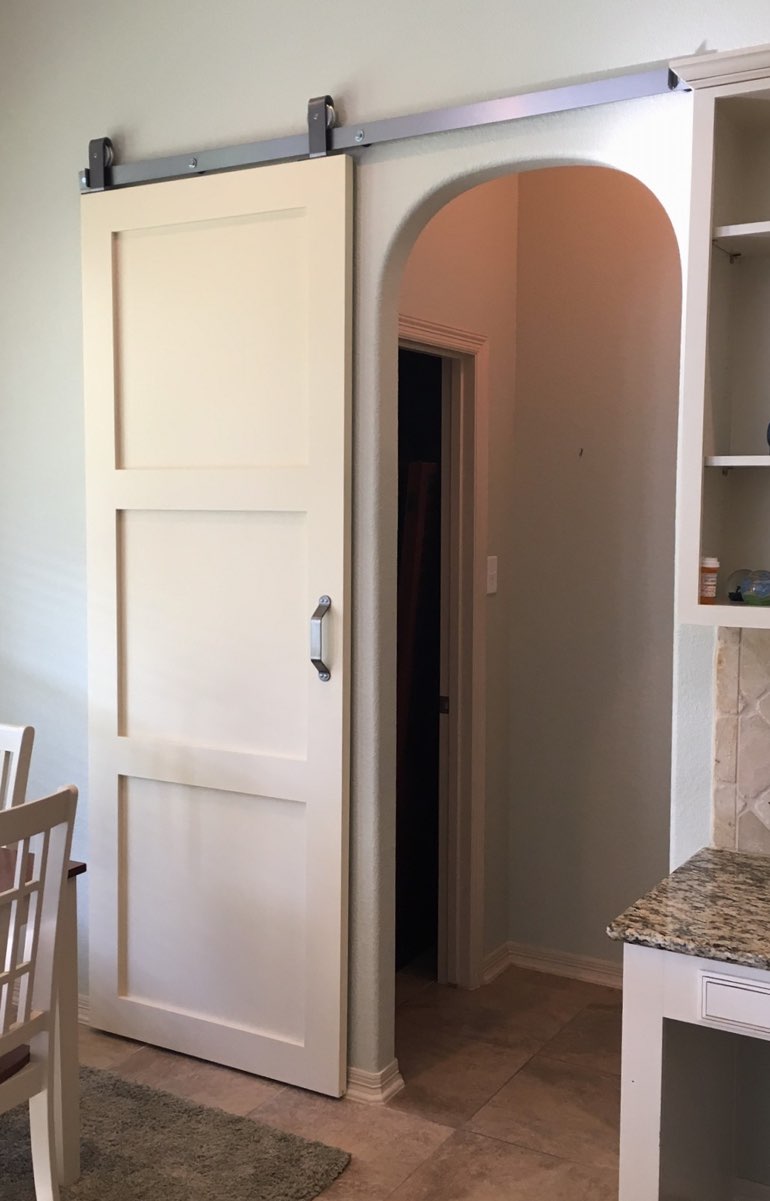 Contemporary style barn door in Las Vegas kitchen.